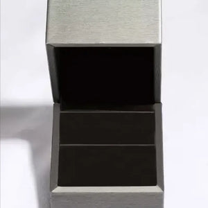 Silver pear cut bypass ring in an open jewelry box
