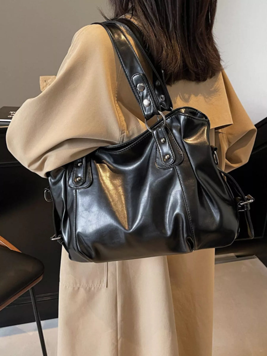 Large black vintage PU leather shoulder bag with silver hardware details.