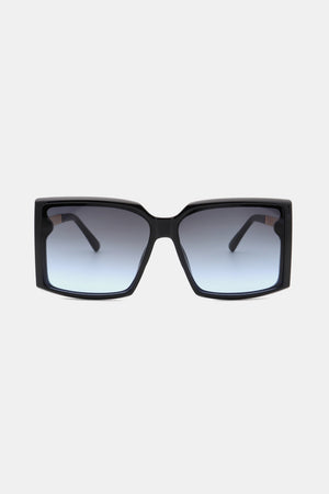 Black geometric sunglasses with gradient blue lenses and bold frames.