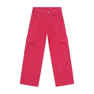 Oversized cargo denim trousers in hot pink with multiple pockets.