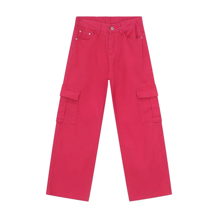 Oversized cargo denim trousers in hot pink with multiple pockets.