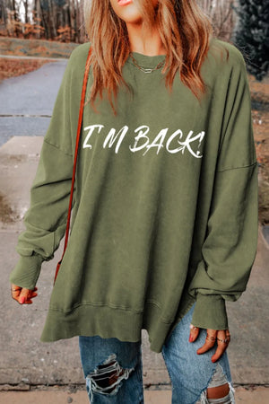 Moss oversized slouch sweatshirt with white I'm Back! graphic, crew neck, and long sleeves.