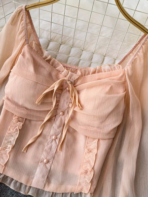 Peach ruffled sleeve maternity blouse with bow and pearl buttons