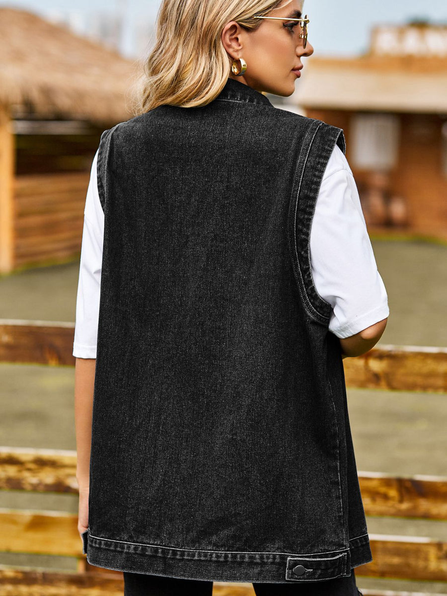 Sleeveless dark gray denim utility vest with button detail at hem
