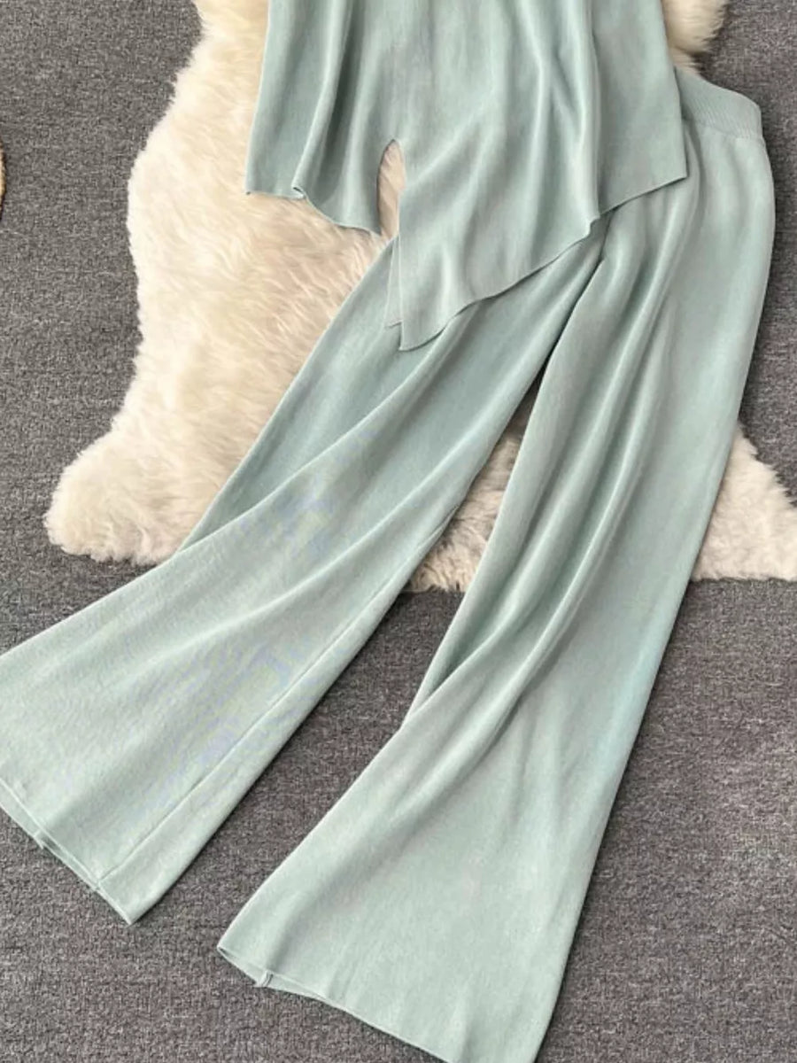Light green tied waist two-piece set with wide leg pants and asymmetric top.