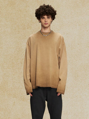 Oversized camel washed cotton long sleeve t-shirt with distressed hem.