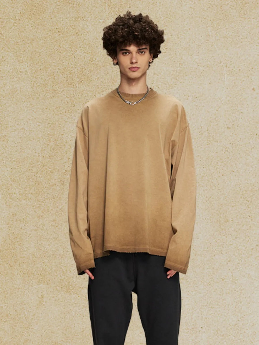 Oversized camel washed cotton long sleeve t-shirt with distressed hem.