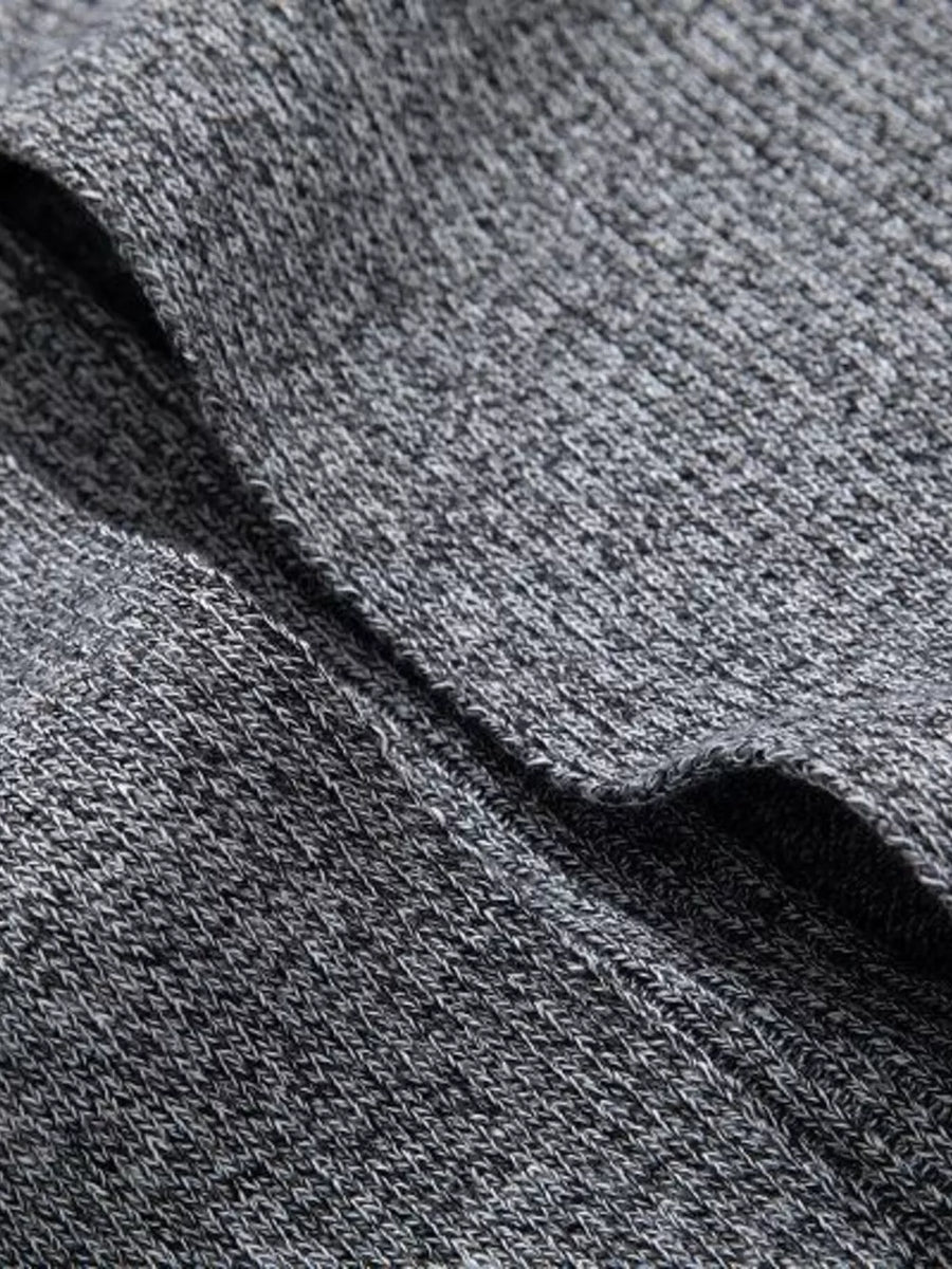 Heathered gray longline cardigan with pockets, showing knit texture.