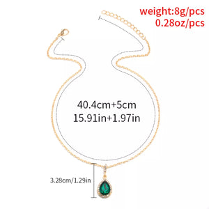 18K gold-plated necklace with dark green teardrop crystal pendant and chain.