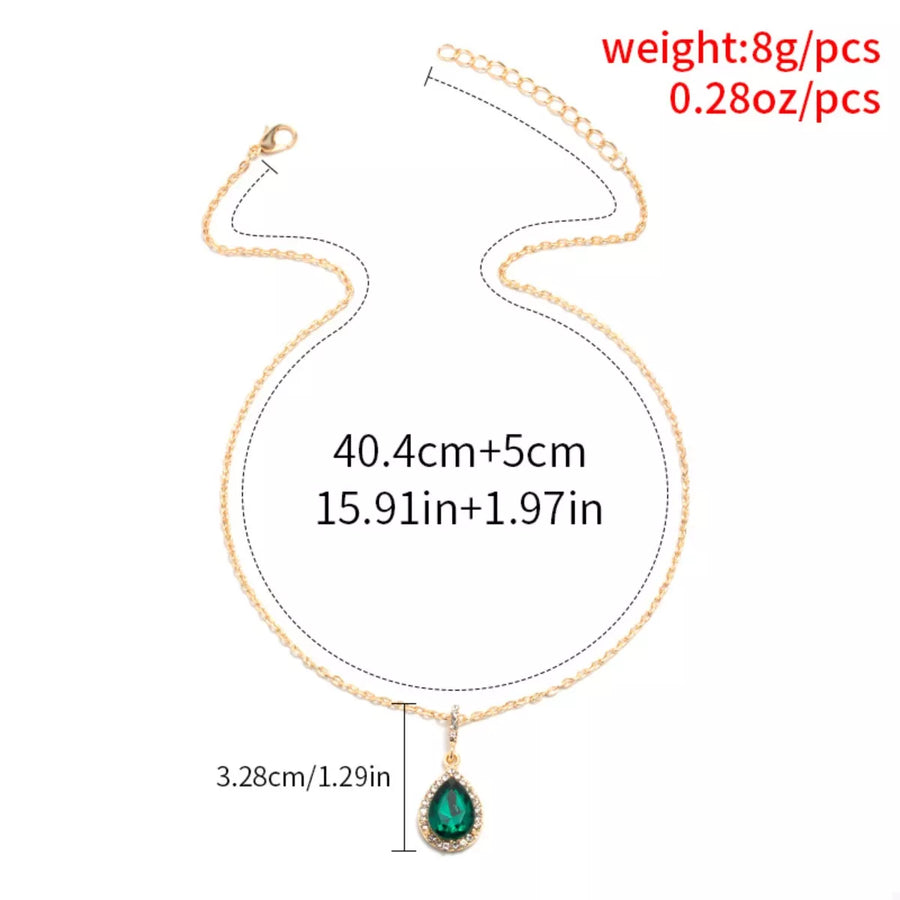 18K gold-plated necklace with dark green teardrop crystal pendant and chain.