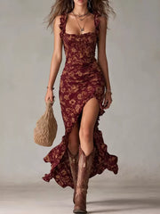 Burgundy floral ruched maxi dress with ruffled straps and high slit.