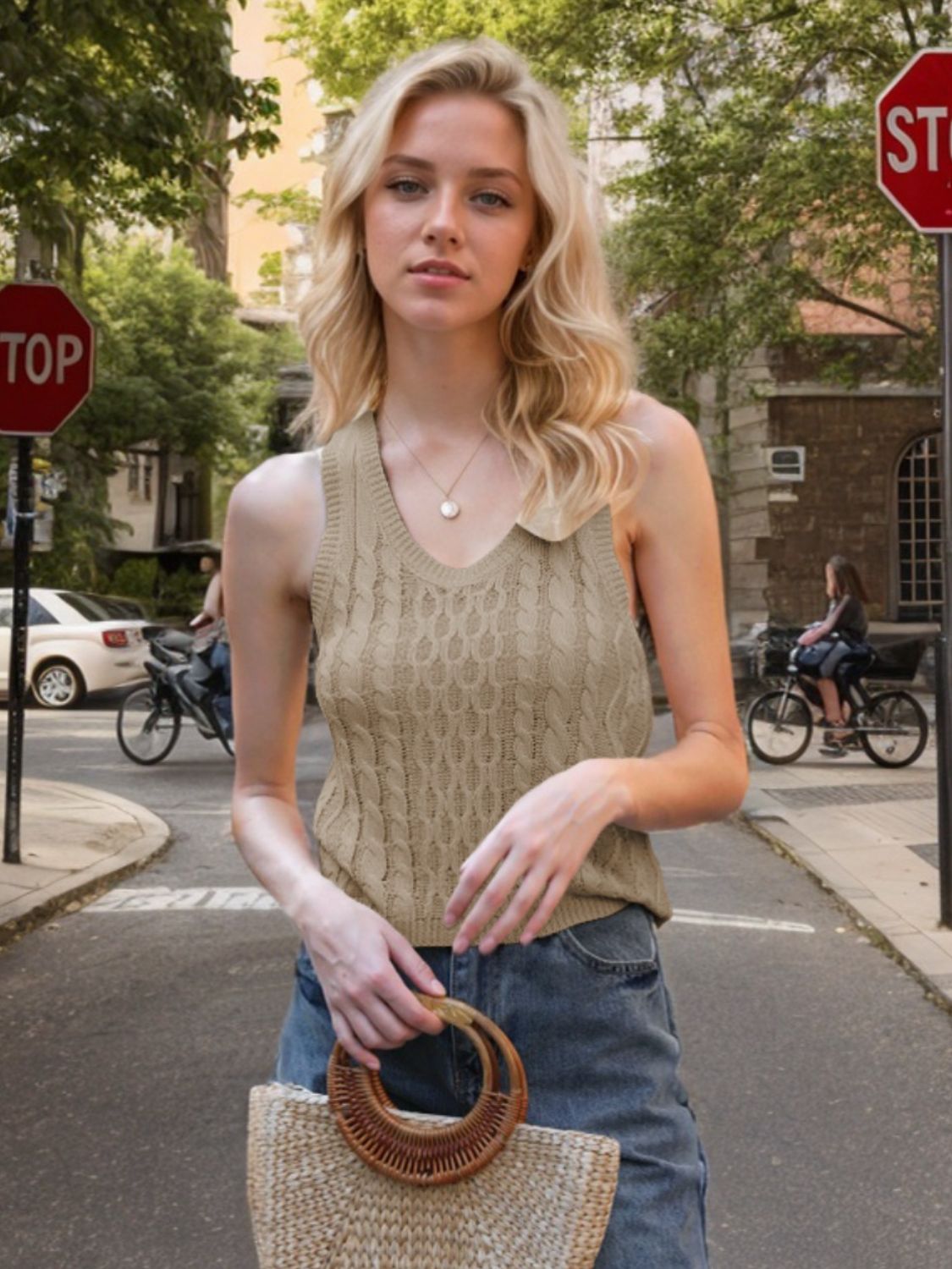 Beige cable knit tank top with a collared neckline and V-neck detail.