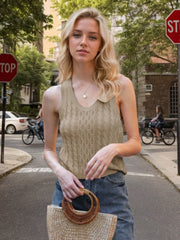 Beige cable knit tank top with a collared neckline and V-neck detail.