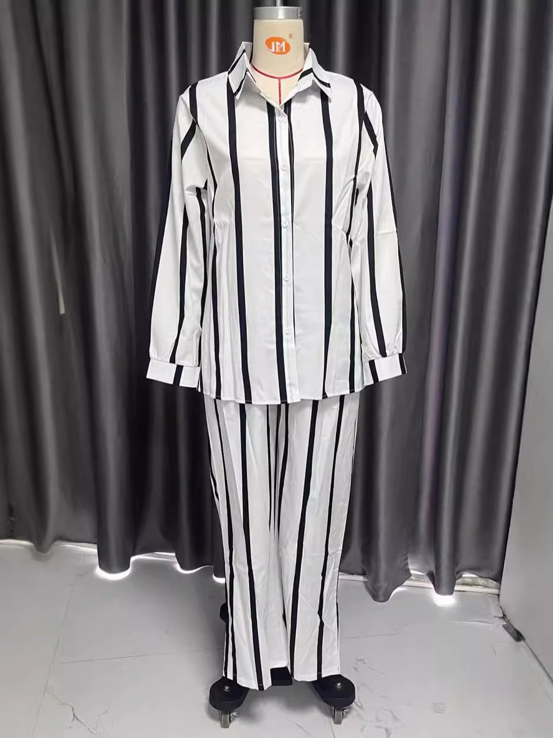 two-piece set in white with buttoned and full-length