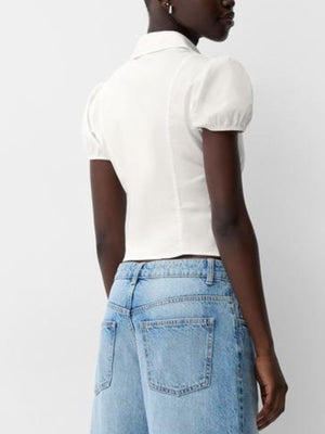 White puff sleeve button-up shirt with collar and short sleeves.