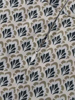 Dress with cream, black, and tan floral print and a white zipper.