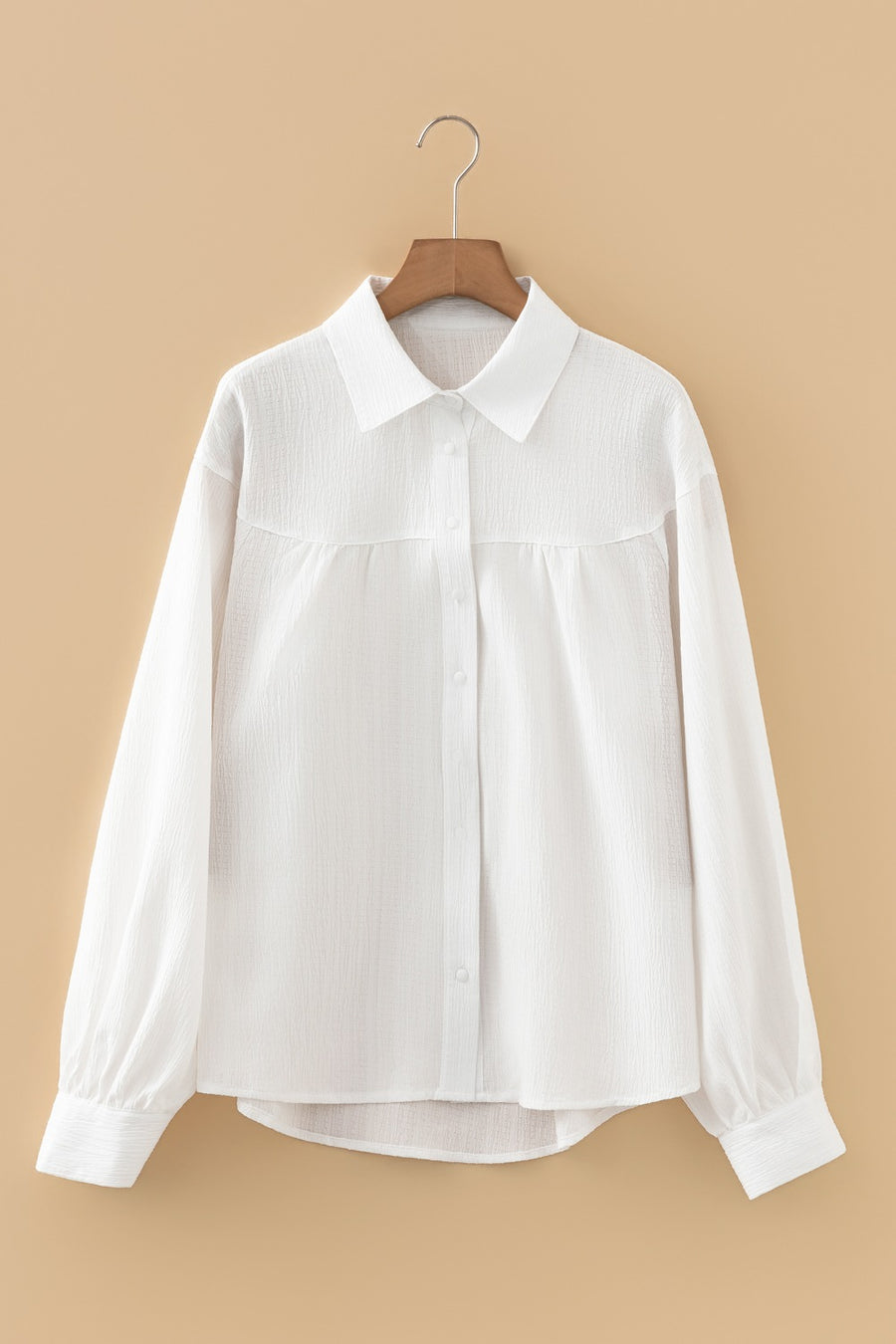 White crinkled texture button-down shirt with classic collar and lantern sleeves.