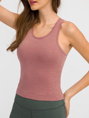 Dusty pink ribbed racerback tank top with a scoop neck.