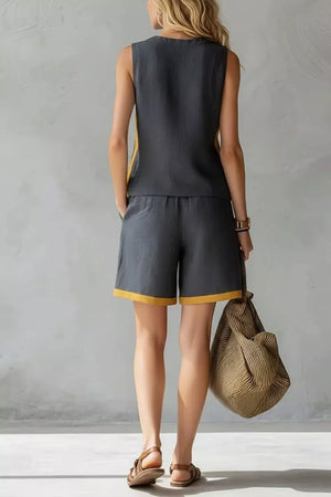 Dark gray tank and shorts set with yellow contrast trim, sleeveless top, elastic waist shorts.