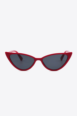Crimson cat-eye sunglasses with dark lenses and bold frames.