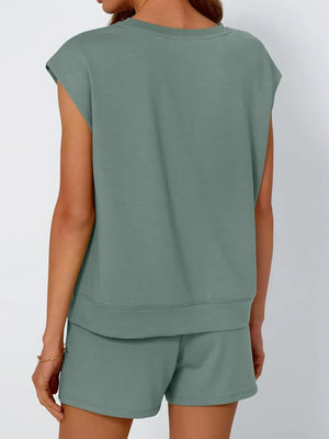Relaxed fit short set in sage green with cap sleeves and drawstring shorts.