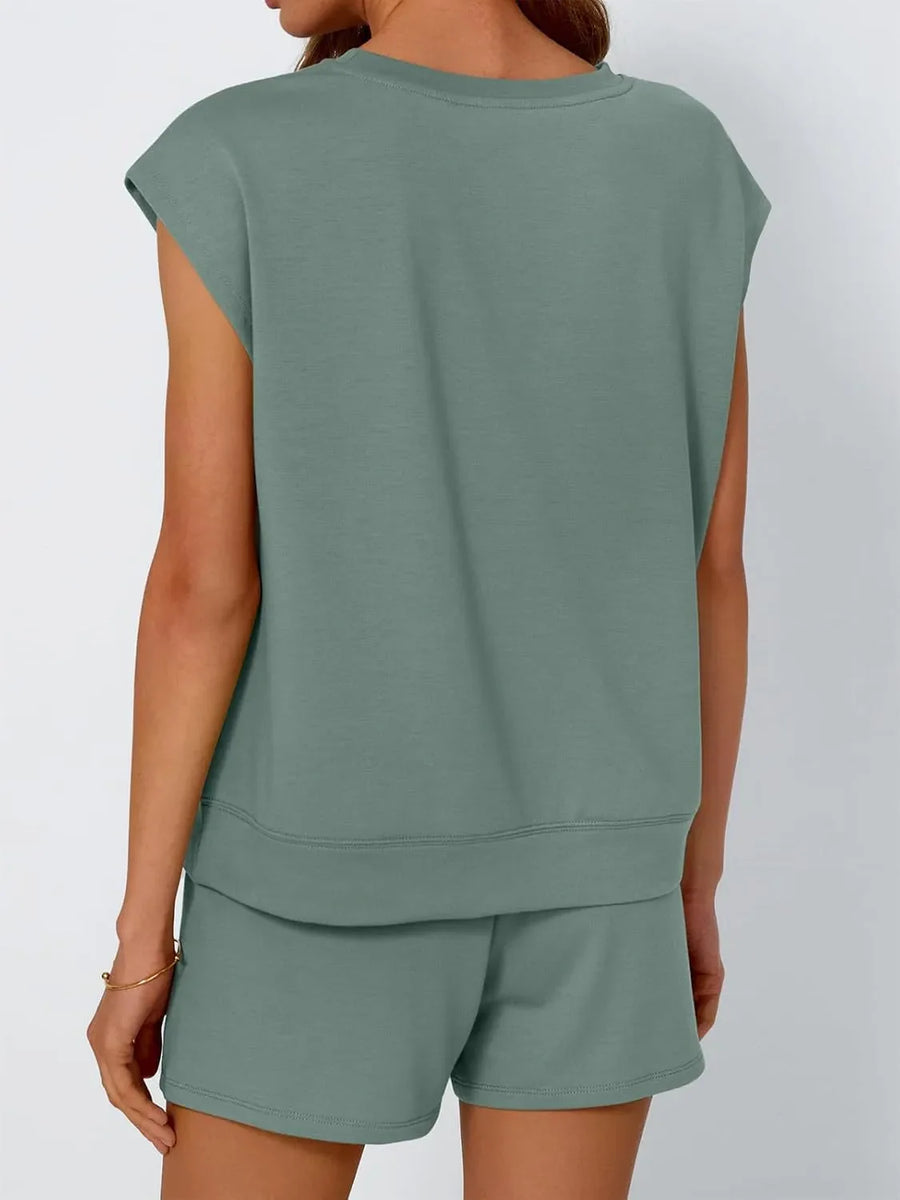 Relaxed fit short set in sage green with cap sleeves and drawstring shorts.
