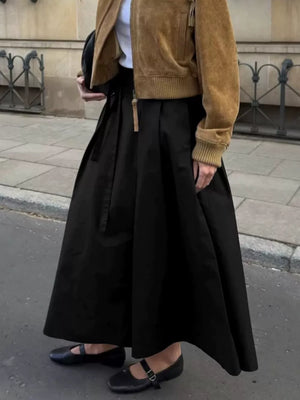 A-line skirt in black featuring belted and A-line fit