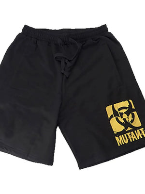 Black activewear shorts with yellow mutant logo graphic and drawstring waist.