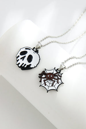 Spooky season necklaces with enamel skull and spider on web pendants