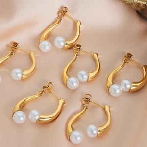 Gold sculptural drop hoop earrings with pearls