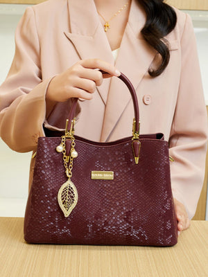 handbag in Wine Red with snakeskin and top handles