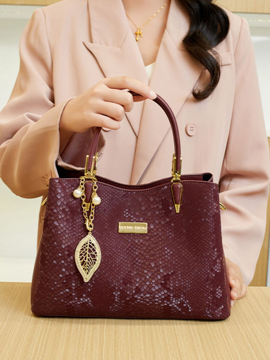 handbag in Wine Red with snakeskin and top handles
