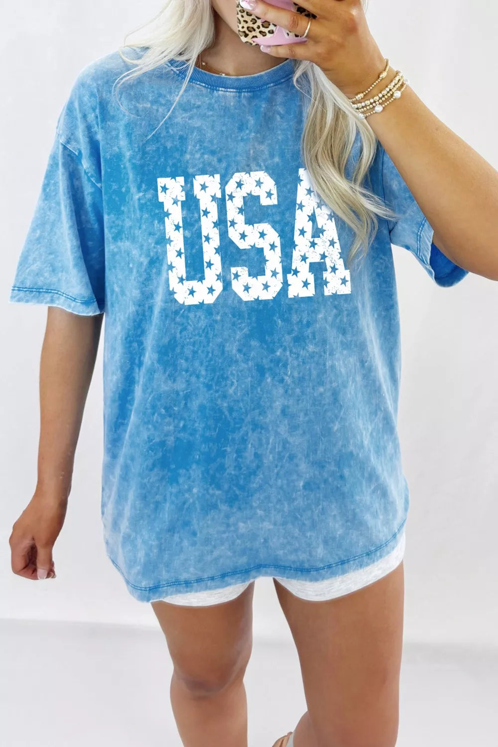 Blue acid wash cotton maternity t-shirt with white star USA graphic and crew neck.