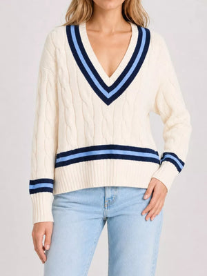 100% polyester Care instructions: Machine wash cold v-neck sweater in cream with relaxed silhouette