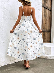 White floral print spaghetti strap midi dress with adjustable straps and a-line cut.