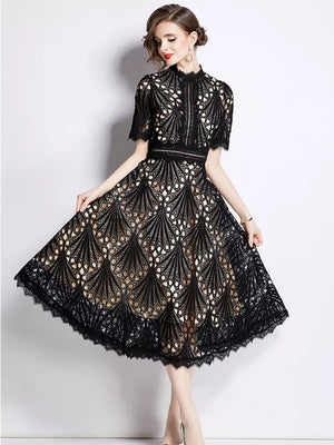Elegant black lace midi dress with delicate sleeves and a-line skirt.