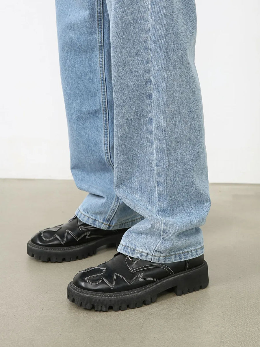 Light blue relaxed-fit denim jeans with subtle seam detail.