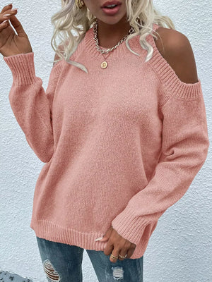 Pink cold shoulder knit sweater with crew neck and long sleeves.