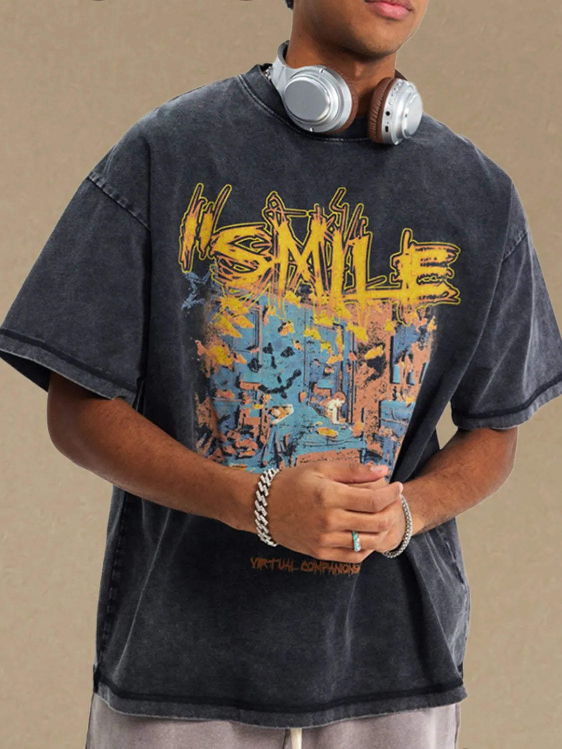 Washed black oversized graphic t-shirt with a colorful abstract design and text.