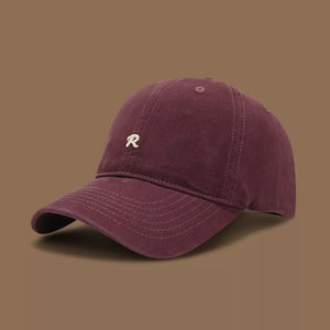 Maroon baseball cap with embroidered R detail and curved brim