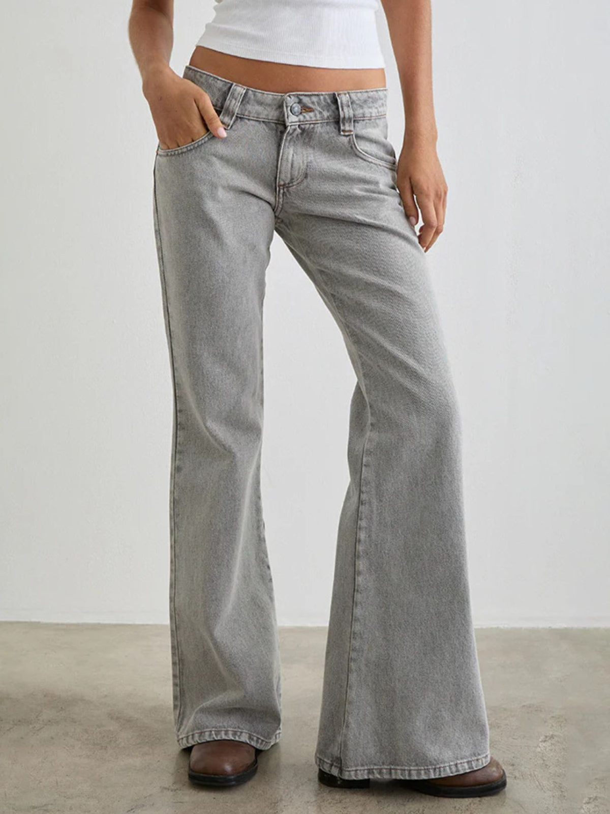 Light gray low rise flare leg jeans with pockets