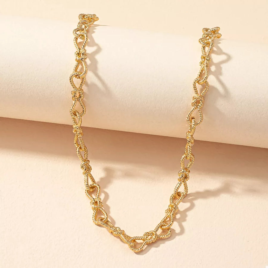 Gold necklace featuring adjustable length and chain link
