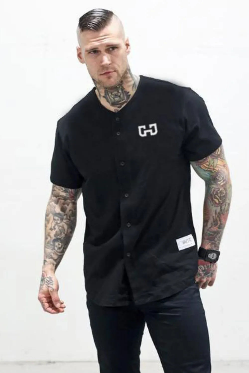 Black baseball jersey with embroidered logo and button front.