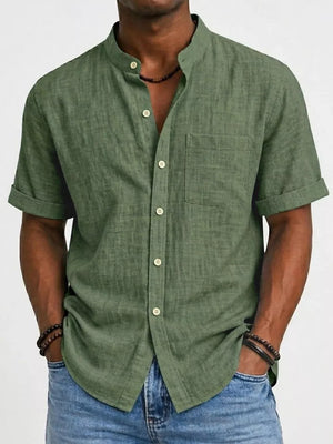 Army green textured cotton band collar short sleeve button-up overshirt with chest pocket.