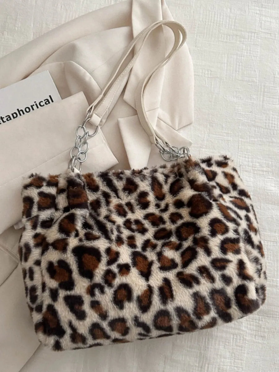 Leopard print faux fur tote bag with chain and leatherette handles.
