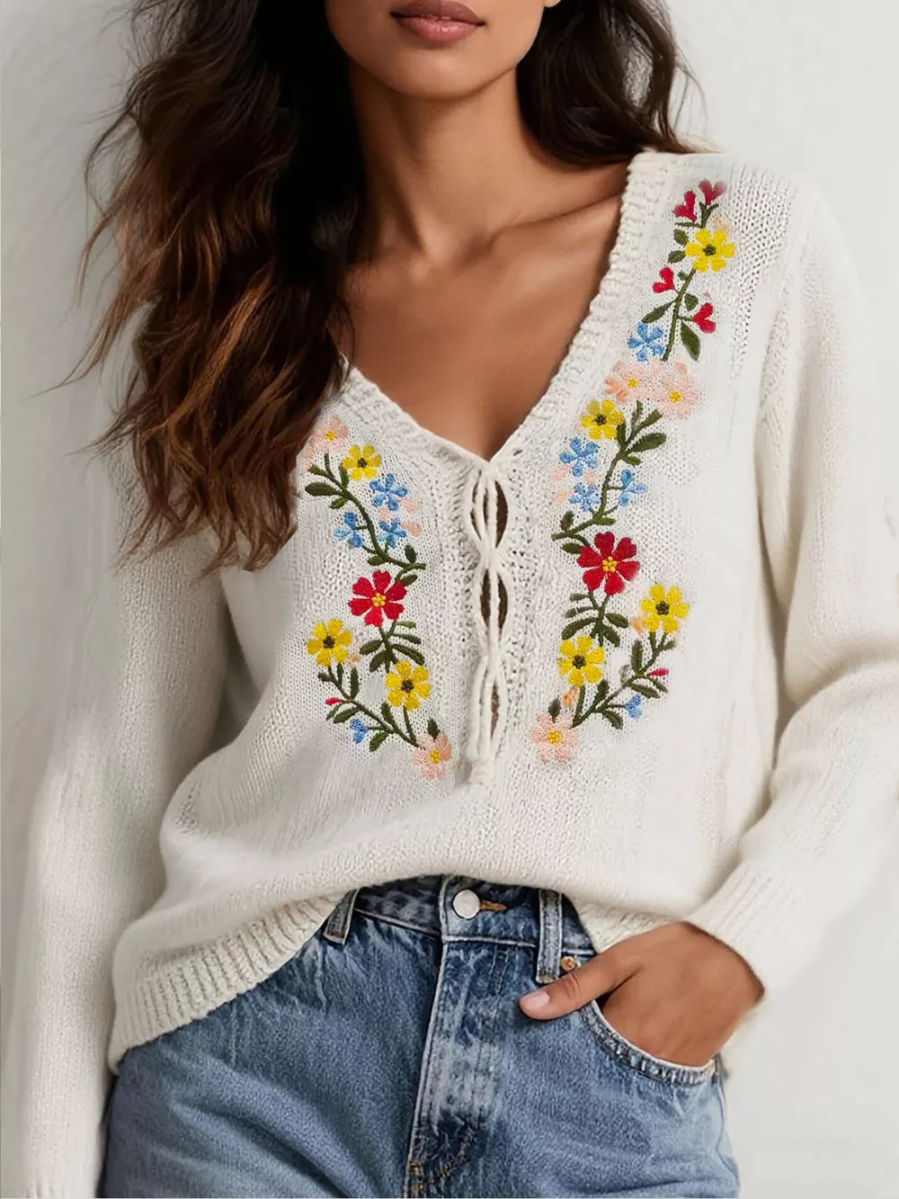 cream v-neck sweater with floral and v-neck