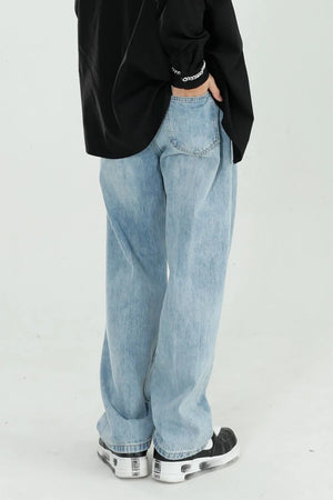 Relaxed fit light wash denim jeans with wide legs and a casual style.