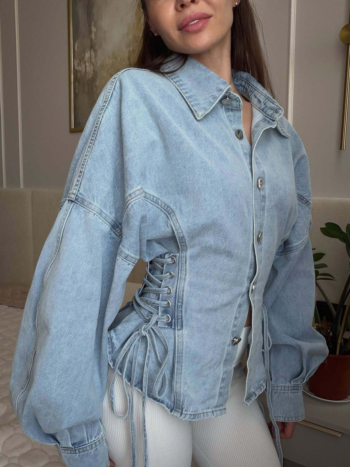 denim jacket in light blue featuring buttoned and oversized fit