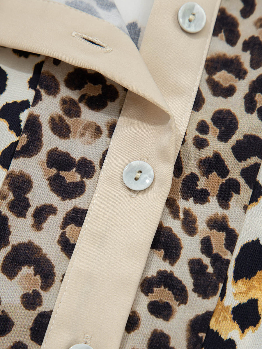 Print button-down shirt with leopard pattern and cream trim.