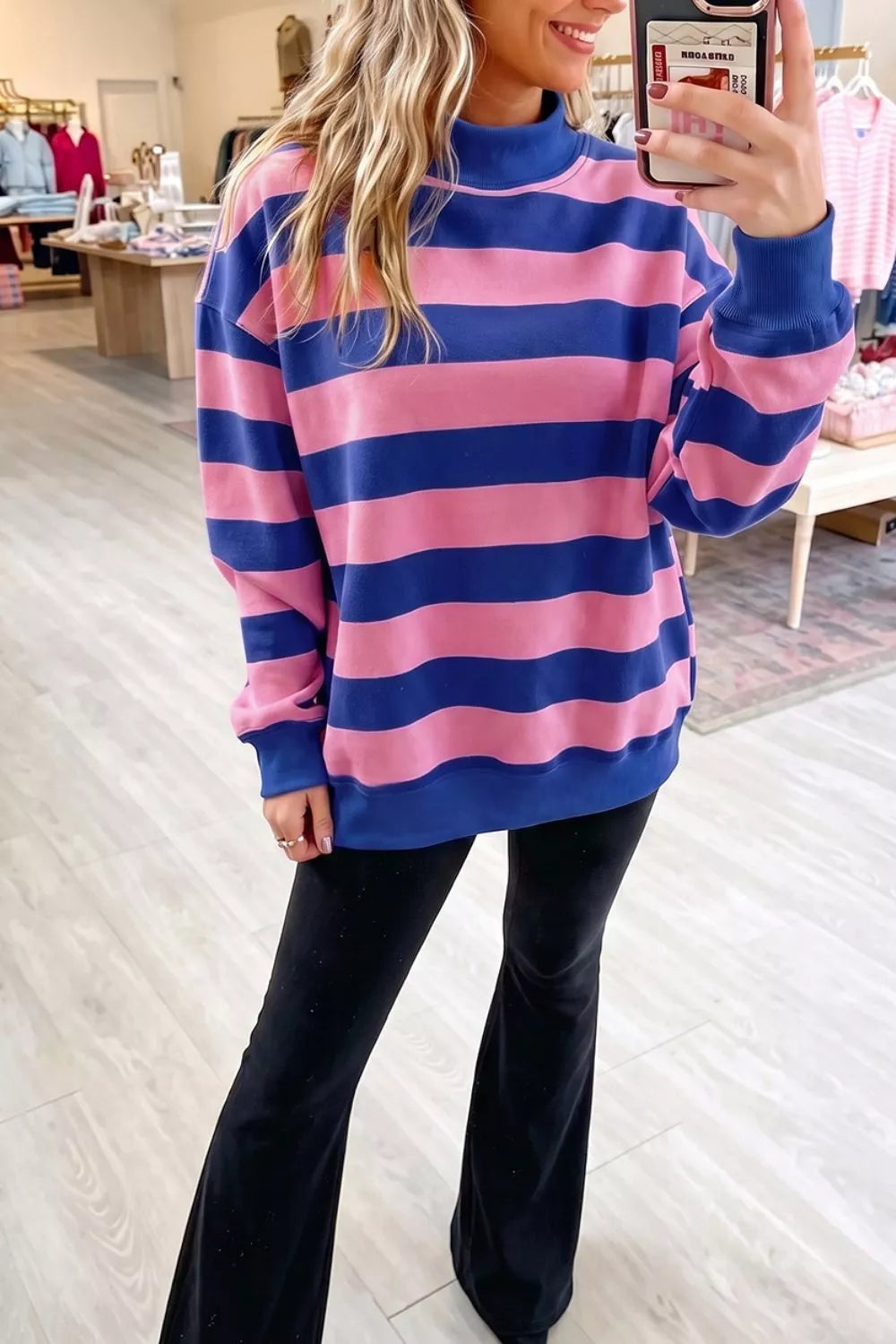 royal blue sweatshirt featuring ribbed cuffs and striped